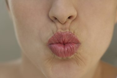 Close up of young woman's puckered lips