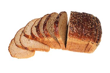 High angle still life of a sliced loaf of bread.