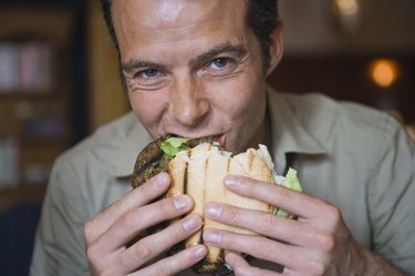 Man eating burger