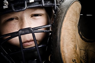 Boy with catcher's mask and glove