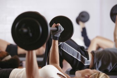 Woman weightlifting in exercise class