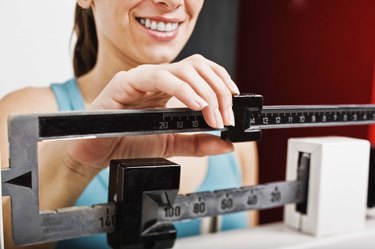 Woman on a scale checking weight