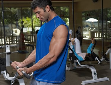 Man doing exercise in gym, close-up