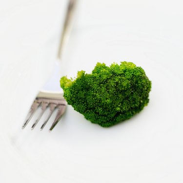 Close-up of a piece of broccoli and a fork