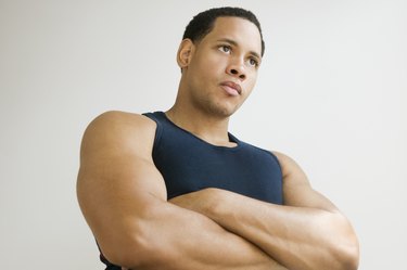Studio shot of African American man with arms crossed
