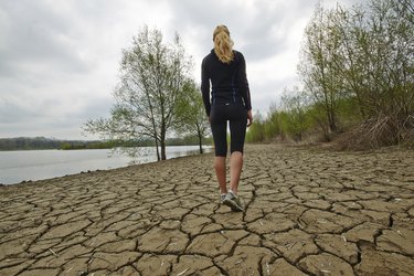 Female walking and running by the water