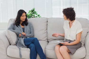 Woman listening to her therapist