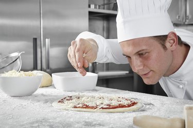Chef preparing pizza