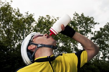 Cyclist drinking an energy drink