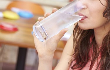 Close up Woman Drinking Fresh Glass Of Water