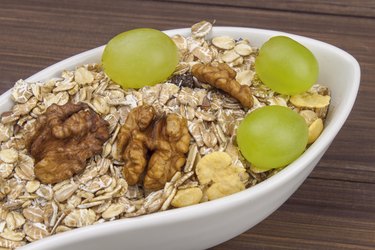 Healthy Diet breakfast of oatmeal, cereal and fruit.