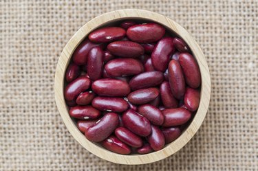 Dried red beans on a wooden table