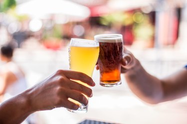 Two friends celebrating with beer. Cheers my friend!