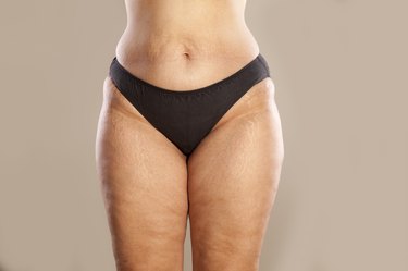 Hips of a very thick woman in black panties