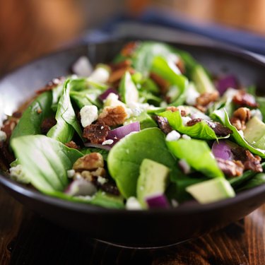 bowl of fresh avocado spinach salad