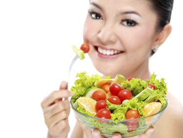 Woman eating salad