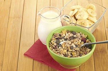 Delicious and healthy cereal in bowl with milk