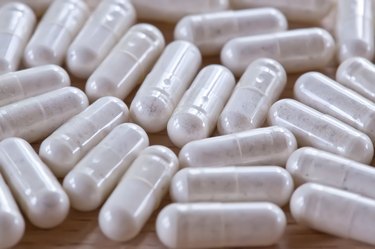 Capsules on a wooden surface