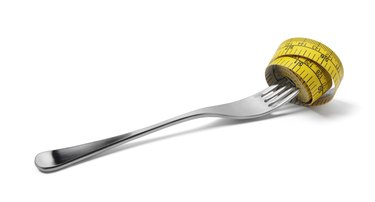 Tape Measure Coiled on a Fork