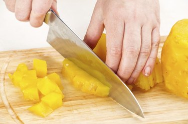 cutting pineapple