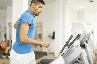 Young man training on a treadmill