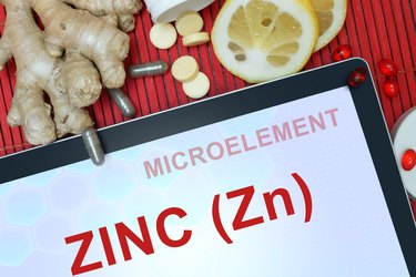Tablet with words Zinc (Zn). microelements.