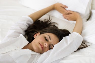 Woman lying in bed