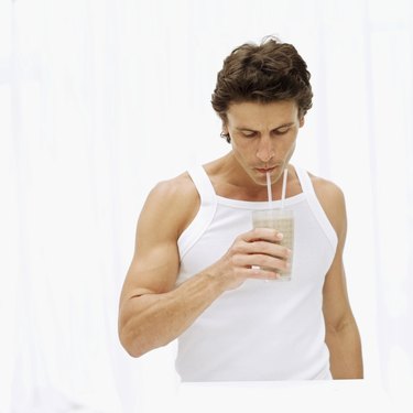 mid adult man drinking a milkshake