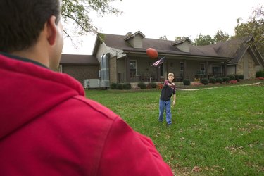 Father and son playing football