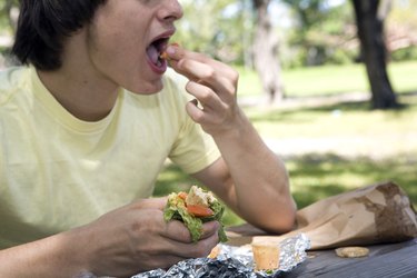 Close-up of a young man eating