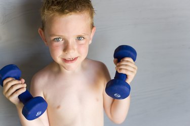 Boy lifting dumbbells