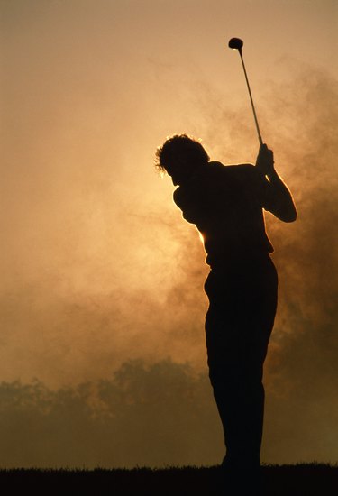 Silhouette of golfer