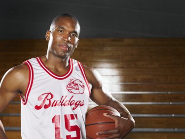 Basketball player with ball, portrait