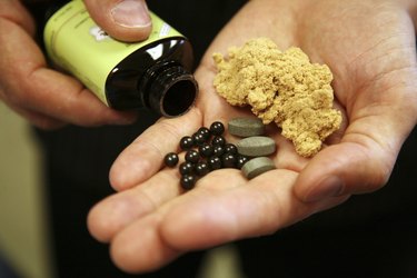 Close-up of a person holding medicine in his palm