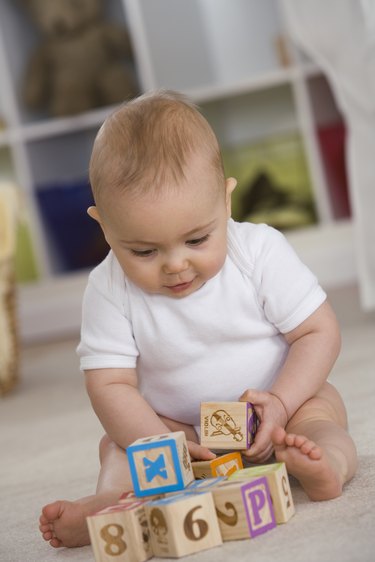 Baby playing with blocks