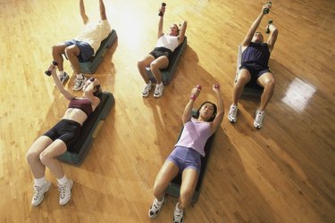 High angle view of a group of people exercising in a step aerobics class