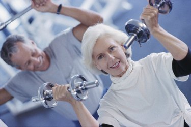 Senior couple exercising in a health club