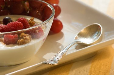 Bowl of yogurt with nuts and berries