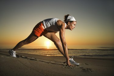 Woman stretching at beach