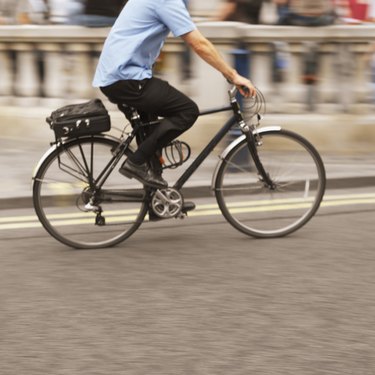 side profile of a man cycling on the street
