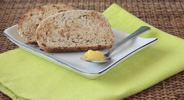 Sliced wholemeal bread with seeds and ghee (clarified butter)