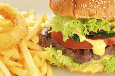 Hamburger with fries and onion rings