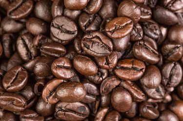 Coffee bean on grunge wooden background