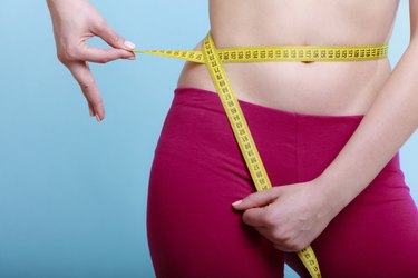 How Much Weight Would I Have to Lose to Go Down a Dress Size?, Livestrong.com