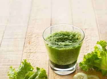 smoothie detox lettuce and cucumber on wooden background