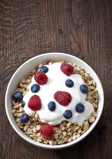 bowl of granola and yogurt with fresh berries