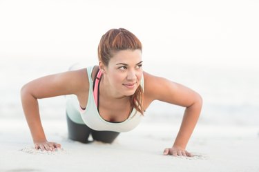 Beautiful brunette doing push ups