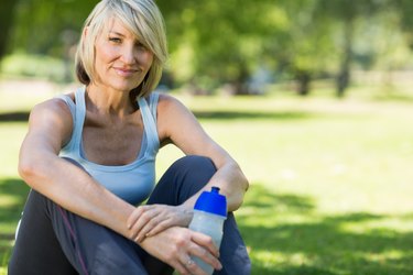 Woman with water bottle in park