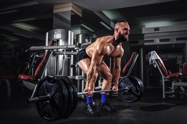 Muscular Man Doing Heavy Deadlift Exercise