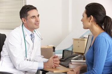 American doctor talking to woman in surgery